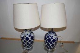 Pair of modern table lamps with blue and white ceramic bases