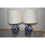 Pair of modern table lamps with blue and white ceramic bases