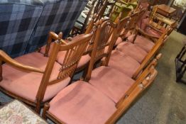 Ten reproduction dining chairs with red upholstered seats
