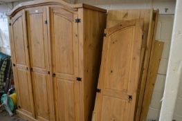 Triple fold pine wardrobe together with another similar