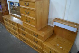 Four piece bedroom set comprised of chest of drawers, another with mirror and two bedside cabinets