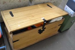 Pine blanket box with a quantity of assorted household linens