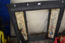 Cast iron fire surround with tiled decoration