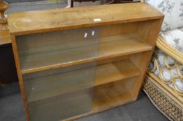 Three tier book shelf with glazed sliding doors