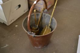 Copper bucket together with a brass warming pan and measures