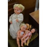 Collection of four children's dolls