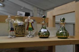 Pair of green glass and white metal scent bottles together with a pair of German porcelain figures