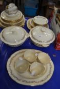 Quantity of cream and gilt decorated Alfred Meekin dinner wares
