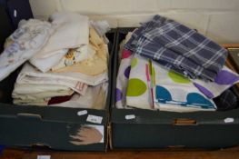 Two boxes of assorted linens and textiles