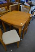 Fold out dining table and four matching chairs