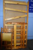 Pine framed single bed and a folding chair