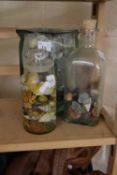 Three storage jars and a quantity of sea glass and shells