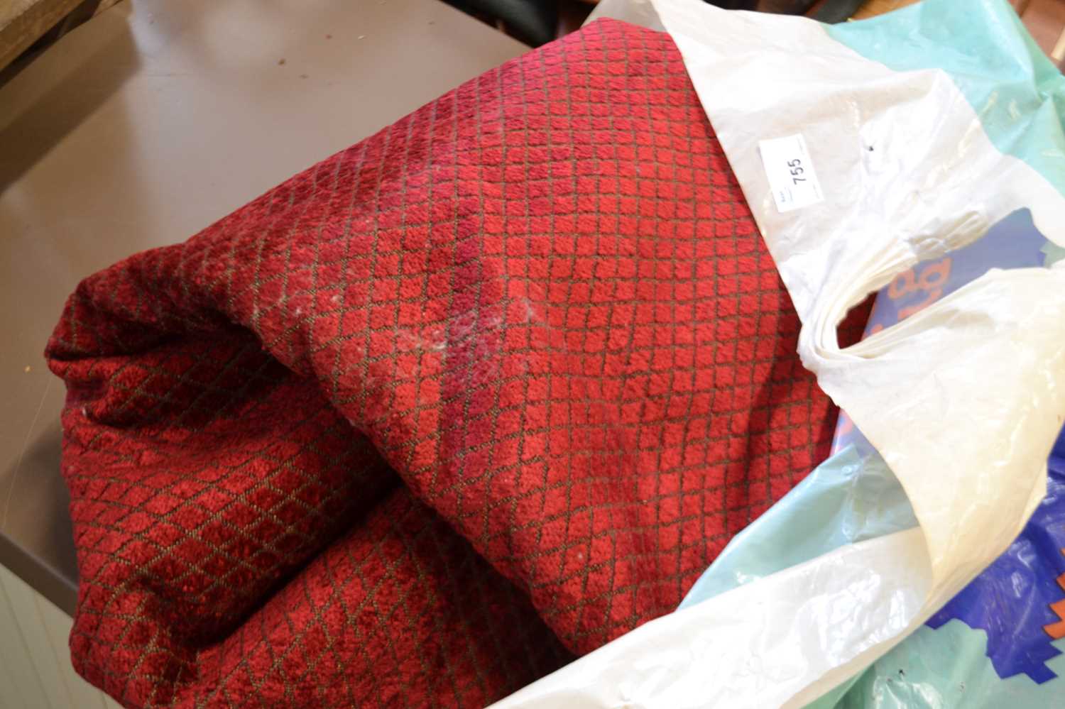 A quantity of red diamond patterned upholstery fabric