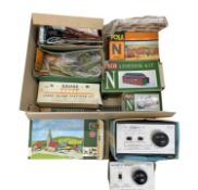A box of various railway diorama accesories, and a pair of Clipper power supplies.