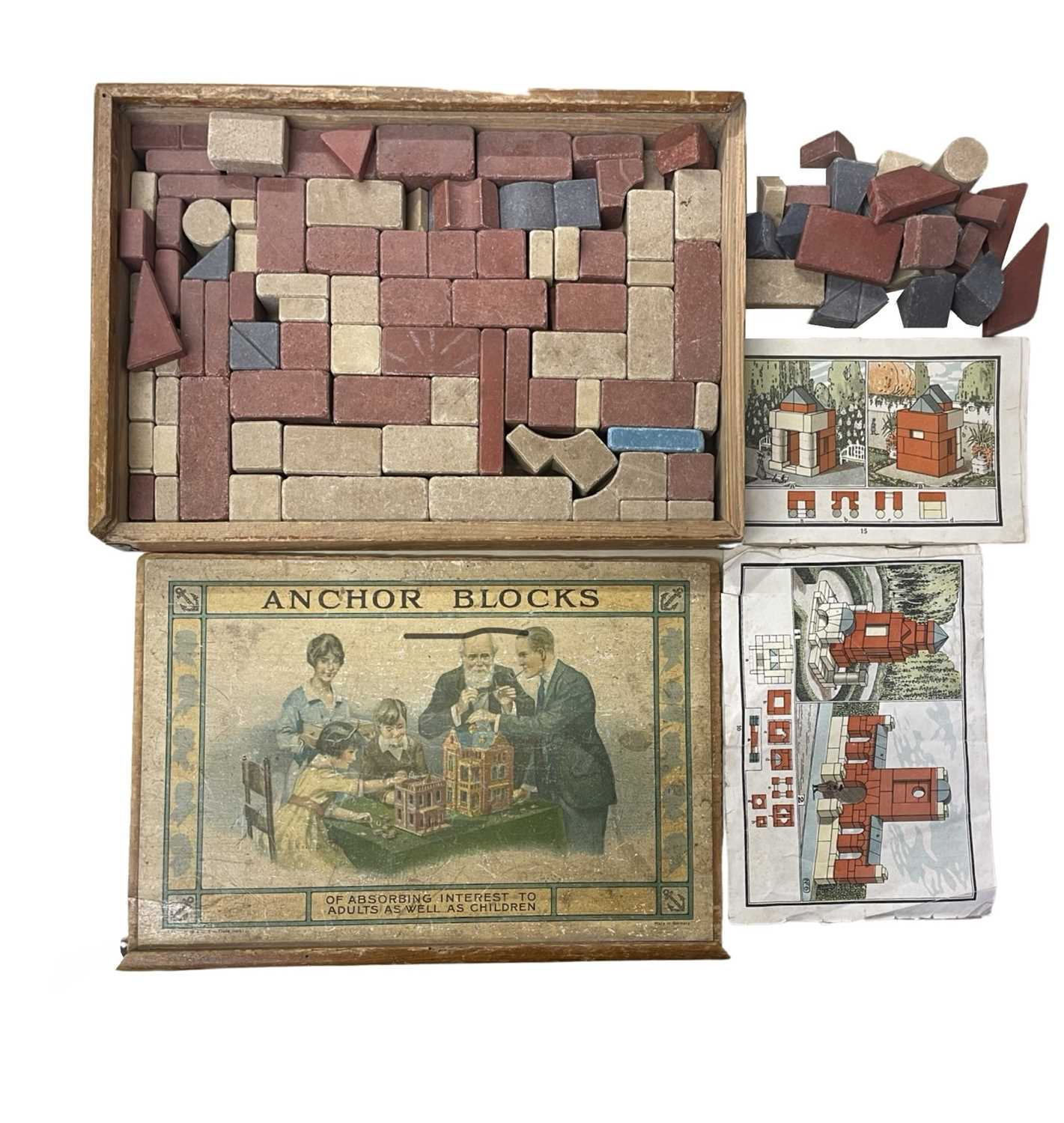 A wooden-boxed set of Anchor Blocks masonry building pieces, with original instructions and
