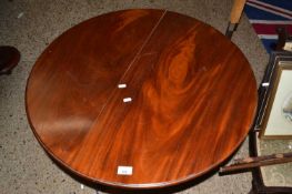 Mahogany circular topped supper table raised on a turned column with a tripod base