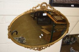 20th Century oval bevelled wall mirror in a gilt finished frame