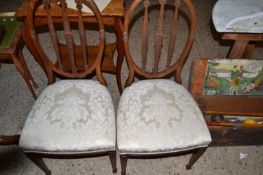 Pair of early 20th Century mahogany side chairs with oval backs and tapering square legs with