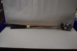 Collection of four modern golf clubs to include Pro-Line, Redneck and others