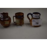 Three Doulton miniature pottery items comprising a Tyg and two jugs