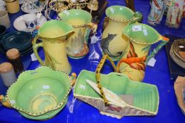 Collection of Art Deco style Burleigh ware, jugs decorated with figures and animals, a further