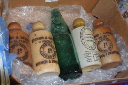 Box of ginger beer bottles of local interest and a reproduction green codd bottle