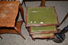 Nest of three green leather top tables
