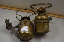 Pair of wall mounted brass oil lamps
