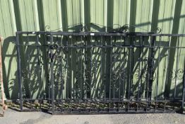 A pair of black wrought iron garage gates