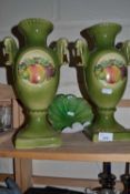Pair of green glazed and fruit decorated vases and a glass dish