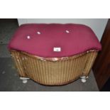 Wicker ottoman with upholstered top