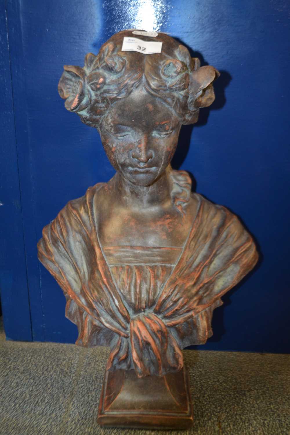 Terracotta head and shoulders bust of a young lady set on plinth base, unsigned