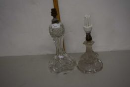 Two cut glass table lamps, one with a stem formed asfrosted dolphins (2)
