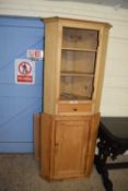 Composite two piece pine corner cabinet, top door detached