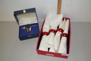 Case of napkins together with a boxed Christening set