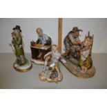 Group of four Capodimonte figures