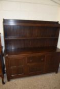 Early 20th Century oak dresser cabinet with two shelf back over a base with three doors and a single