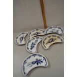 Set of six crescent formed Bisto dishes with blue and white decoration produced for Mortlock, Oxford