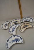Set of six crescent formed Bisto dishes with blue and white decoration produced for Mortlock, Oxford