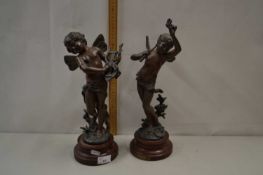 A pair of bronzed finish Spelter models of cherubs