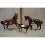 Group of three brown Beswick horses