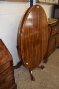 19th Century oval table raised on a four footed base with casters