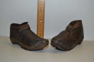 Pair of child's antique leather shoes with iron mounted soles