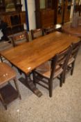 20th Century oak refectory dining table and four rush seated chairs, table 153cm long