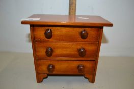 An Apprentice type three drawer table top chest
