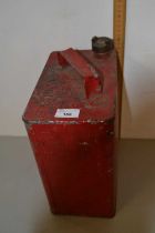 A vintage red painted metal petrol can