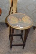 Small circular occassional table with butterfly decorated top