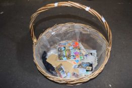 Wicker basket and a quantity of stamps