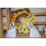 A pair of seated lady book ends and an Art Nouveau style wall mirror