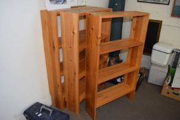 Three three tier freestanding open bookshelves